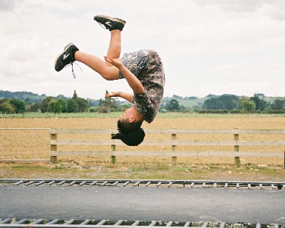 girl jumping on trampoline