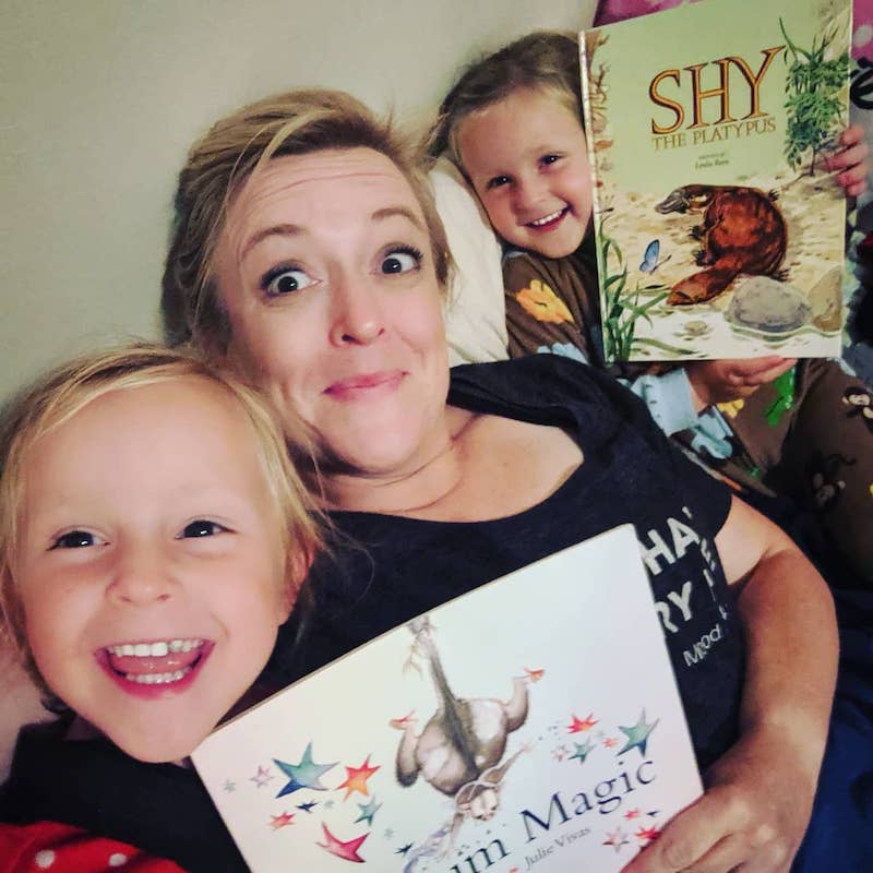 mother and 2 girls reading