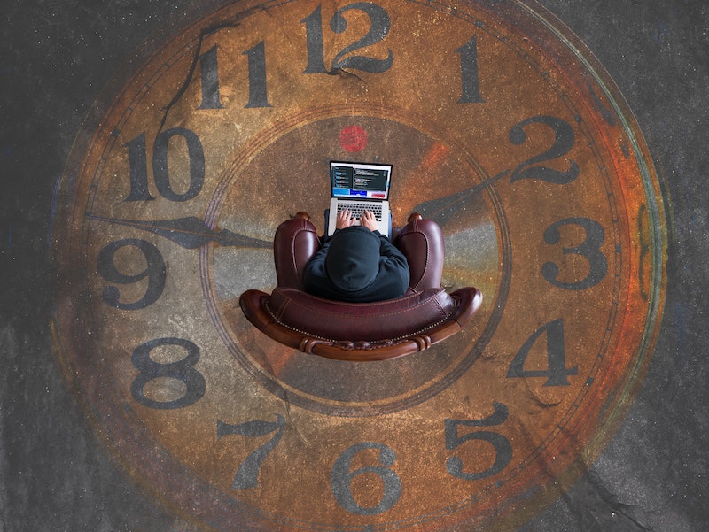 man sitting on clock