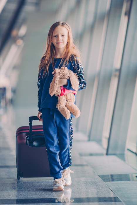 little girl traveling