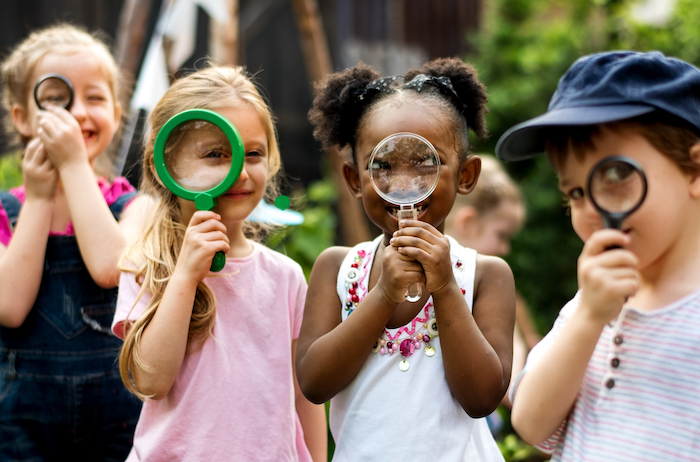 children with magnifying glasses