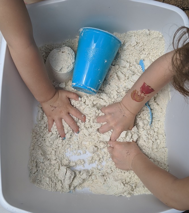 children playing with moon sand