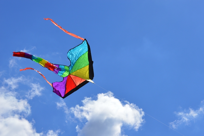 rainbow kite in blue sky