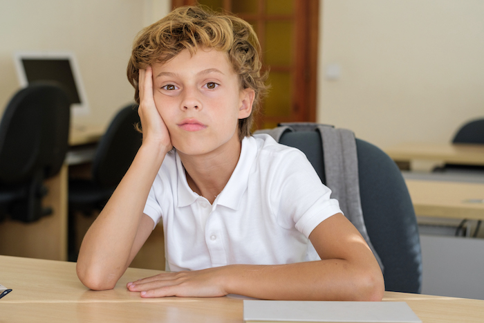 frustrated child sitting at desk