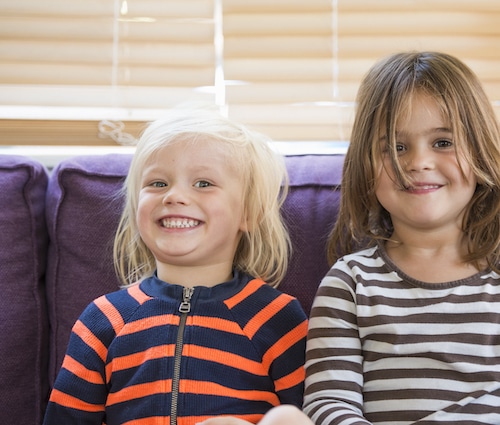 small boys sitting together on couch